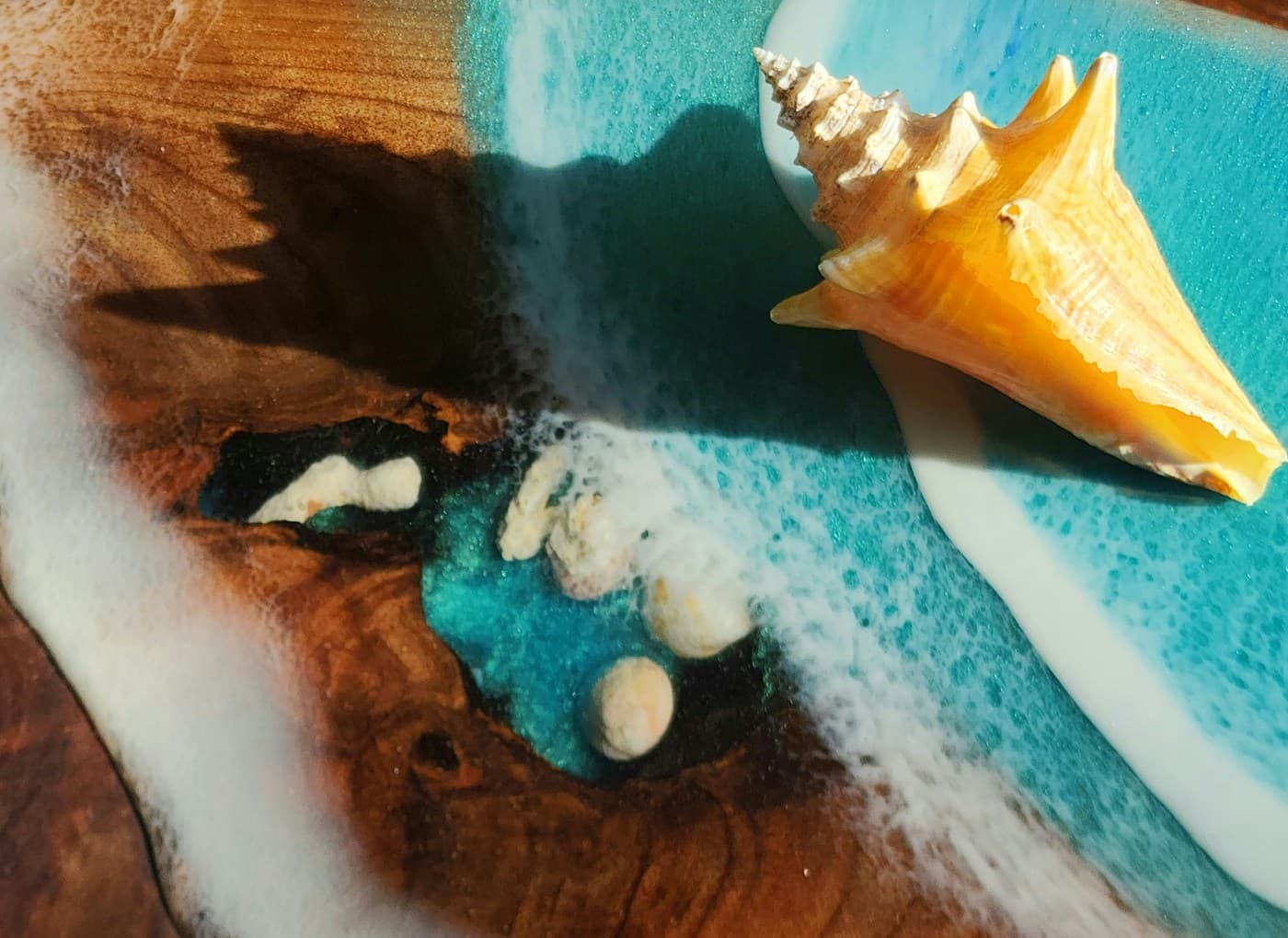 Ocean-blue epoxy resin with a seashell